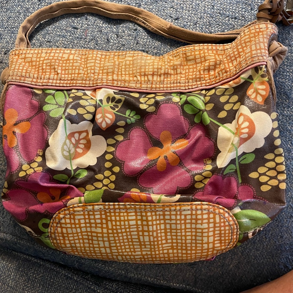 Fossil purse with wear
